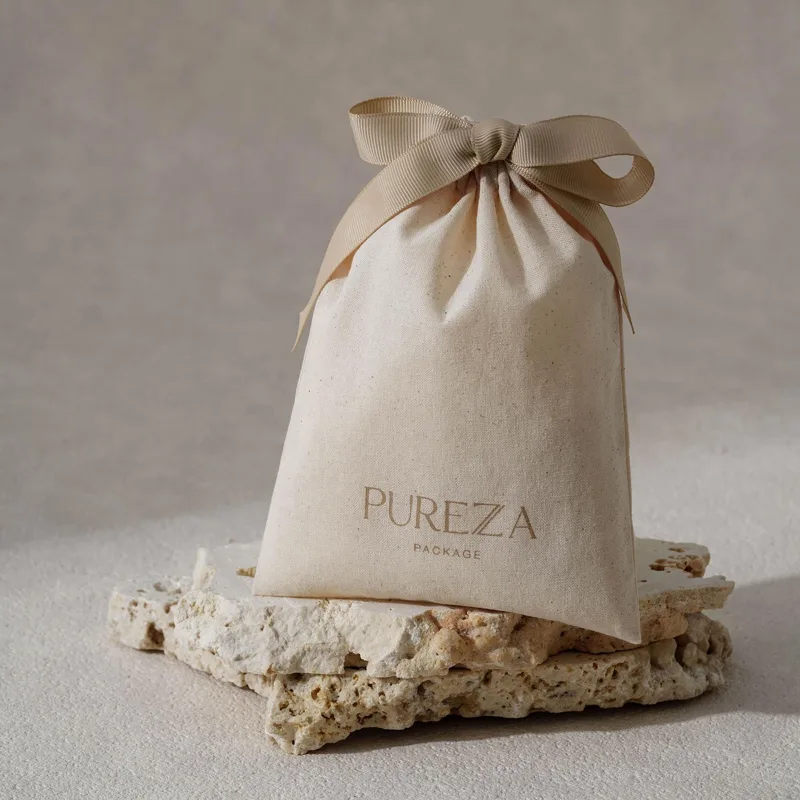 Pochette à cordon en coton nat - Luxury Skincare Gifts avis et prix