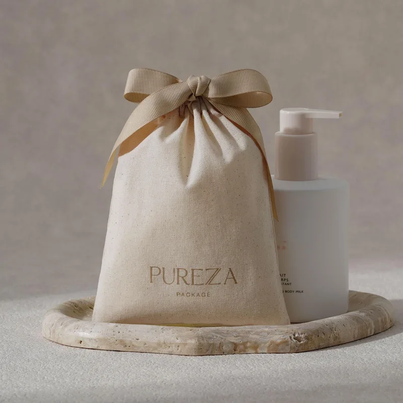 Pochette à cordon en coton nat - Luxury Skincare Gifts avis et prix